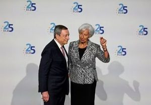 European Central Bank president Christine Lagarde speaks with former ECB president Mario